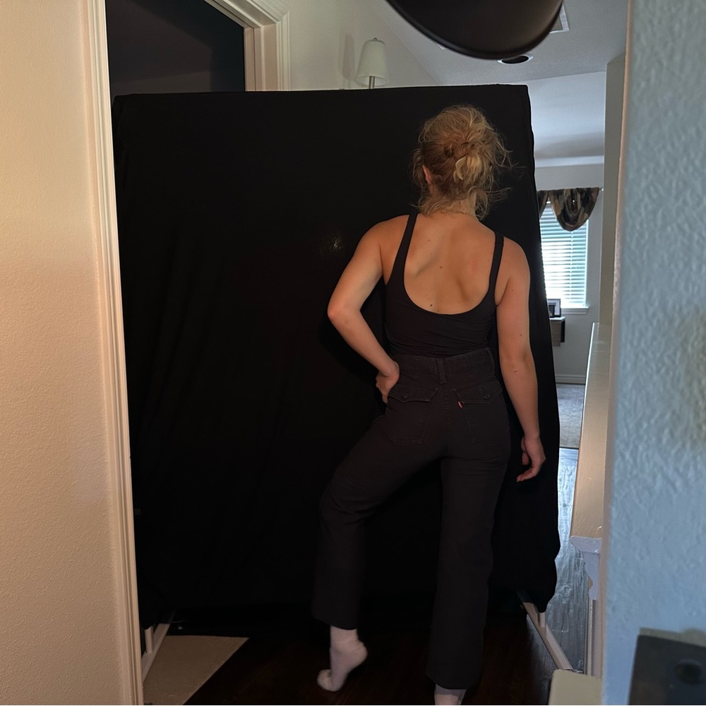 Levi’s high waisted black jeans with buttoned pockets